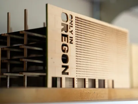 Model of mass timber building with the words 'Only in Oregon' etched on the side