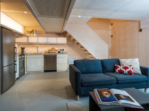 Kitchen and living room designed with mass timber